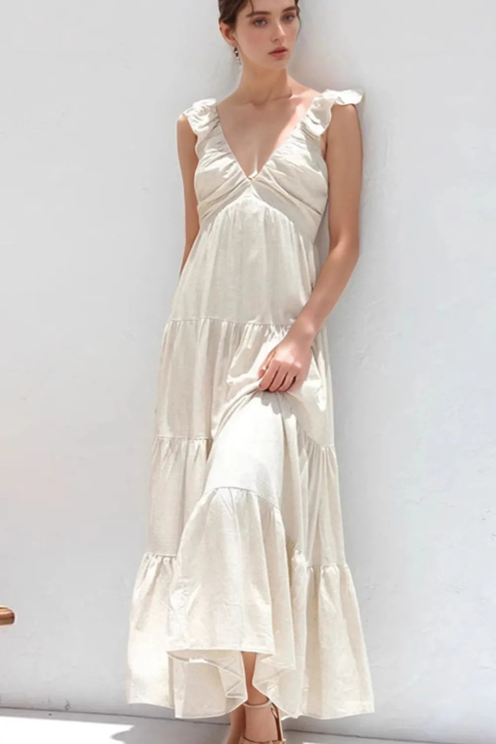 Model wearing sustainable ruffled tiered dress in breathable cotton- vegan clothing, vegan friendly clothing, plant based clothing, cruelty free clothing, vegan dress