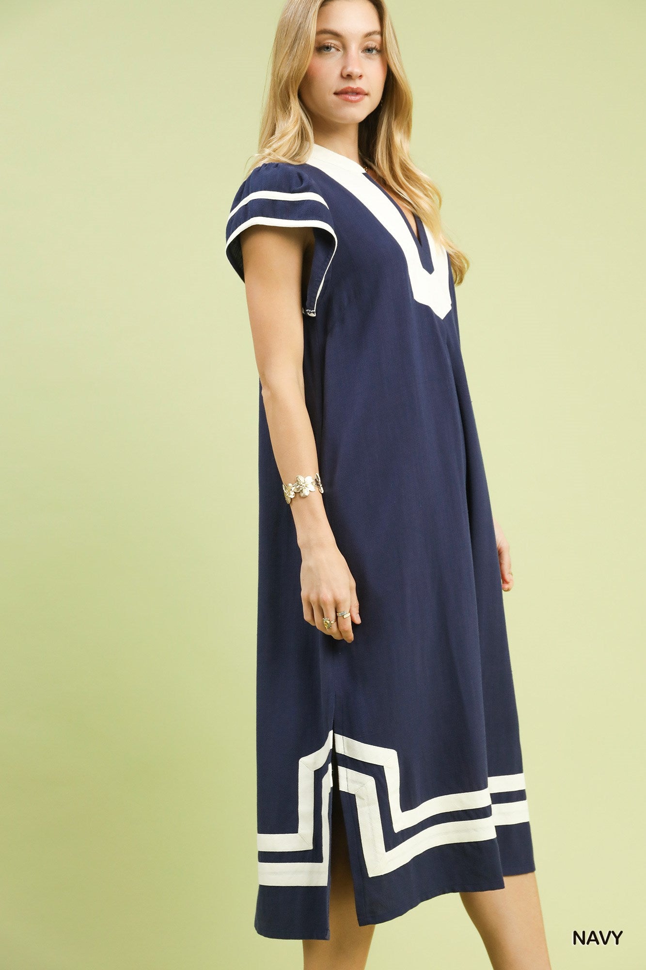 Woman wearing breathable linen cotton midi dress in navy, buy sustainable clothing online, organic cotton clothing for women, sustainable summer dress,  plastic free clothing women